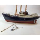 A wooden model of a boat. The Nordkap A/F Length 80cm