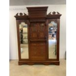 An art Nouveau mahogany compactum with single wardrobe with either side. W:189cm x D:79cm x H:236cm
