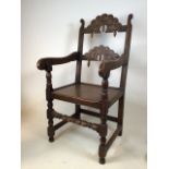 A carved oak Yorkshire chair. Seat height H:45cm
