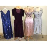 A 1930s velvet dress together with two satin mid century dress and a vintage Eastex dress