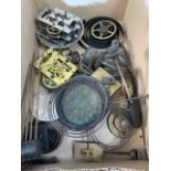 A box of old clock parts .