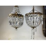 Two drop lustre chandeliers with gilt mounts. (A.F)