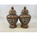 A pair of oriental decorative lidded jars. H:26cm