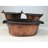 Three early 20th century copper cooking pots. Largest W:30cm x D:30cm x H:23cm