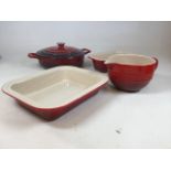 A cast iron enamelled Cuisine lidded casserole dish W: 28cm together with two Le Creuset stoneware