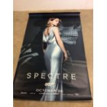 A James Bond movie poster for Spectre featuring Lea Seydoux. Poster has been stapled at top and