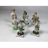 A collection of Derby style Putti figurines, tallest being 14cm