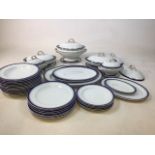 A Royal Worcester Vitreous dinner service with dark blue and green trim. Handles of tureen lids