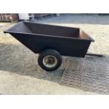 A garden trailer for a lawn mower. By SCG supplies. Slight hole and rust to inside. W:76cm x D:121cm