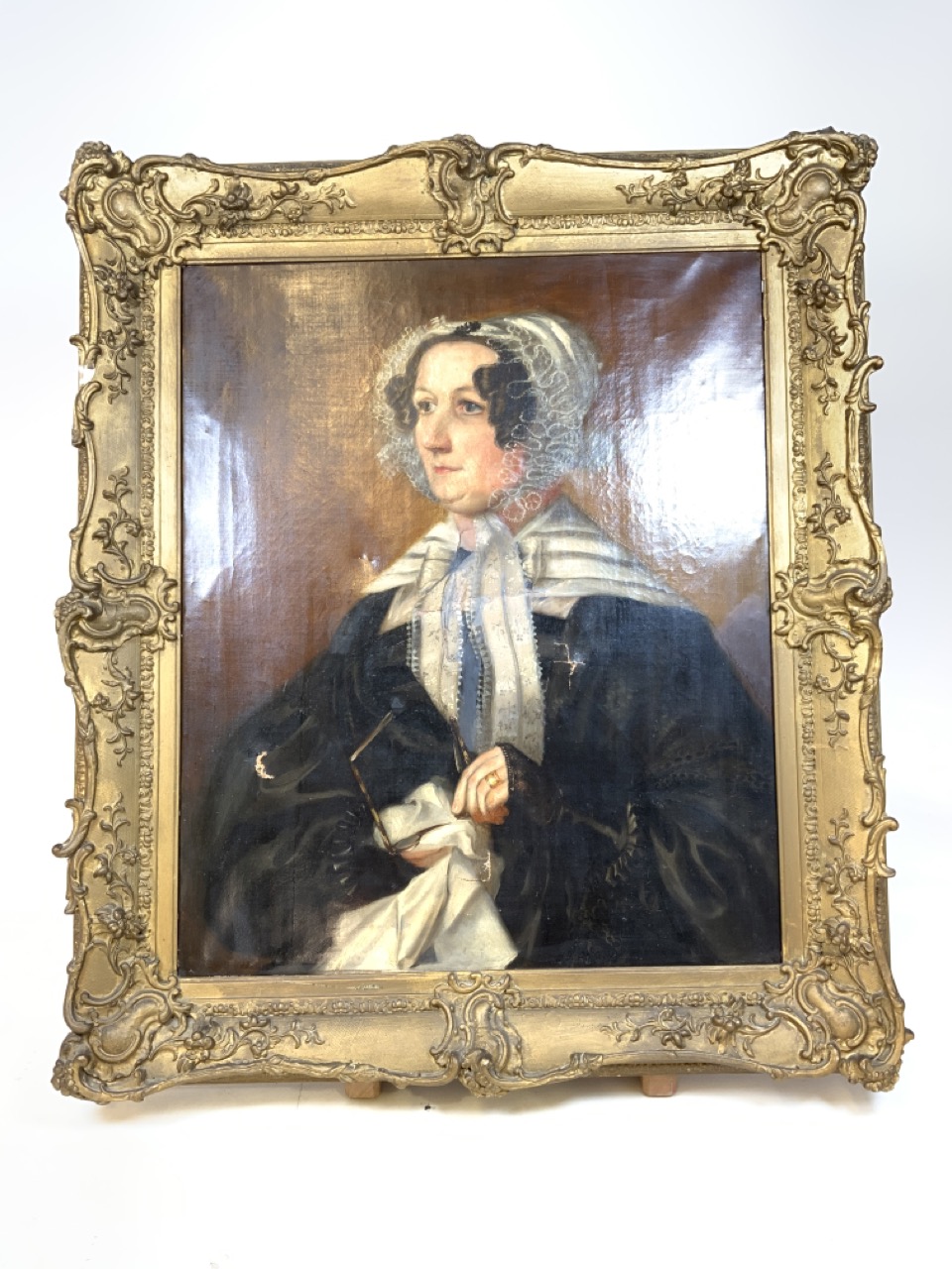 A large oil on canvas portrait in ornate gilt frame. W:63cm x H:77cm