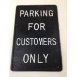 A cast iron Parking sign with painted lettering Parking for customers only W:24.5cm x H:37cm