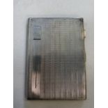 A silver cigarette case, marked Birmingham 207 grams.