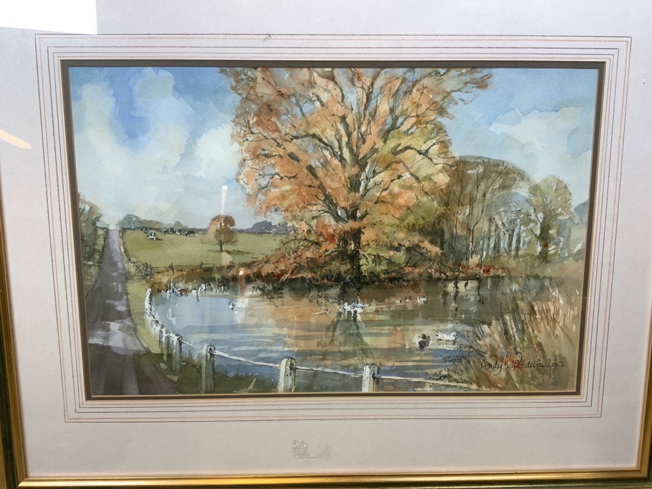 Andy le Poidevin (British 20th century) watercolour on paper of a lake scene. In gilt frame.