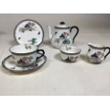 Early twentieth century Royal Doulton tea set for one . Decorated in oriental style. Height of