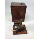 A Microscope by Edward Bryan, Manchester on mahogany mount in box. (A/F) W:19cm x D:15cm x H:25cm