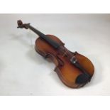 A wooden violin 59cm length with violin bridge marked Aubert and LJ Stainer