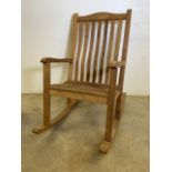 A Teak garden rocking chair by Alexander Rose garden furniture West Sussex England. W:62cm x D: