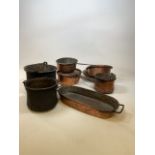 Five early twentieth century copper cooking pans together with a poaching pan and two bowls W:29cm x