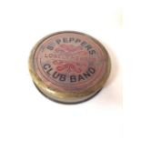 Beatles memorabilia. A brass Sgt Peppers Lonely Hearts Club Band compass with twist of lid.