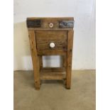 A early 20th century butchers block of small proportions. Drawer and rack to base. W:47cm x D:47cm x