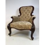 A Victorian mahogany upholstered button backed chair. Seat height H:42cm