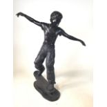 Bronze figure of a boy riding his skateboard. W:47cm x D:67cm x H:86.5cm