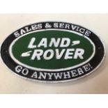 A cast iron Land Rover advertising sign