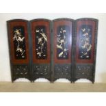 An early 20th century double sided Chinese four fold screen ornately carved oak panels with ivory