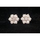 Diamond seven stone petal earrings on platinum.