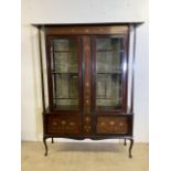 An inlaid Art Nouveau double display cabinet, with interior felt lined back and shelves, with