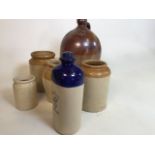A John Hearn of Beaminster flagon together with a Monarch foot warmer and four stoneware jars W:24cm