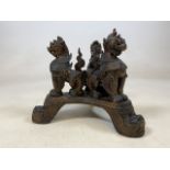 A carved oriental wooden dragon stand. W:30cm x D:30cm x H:25cm