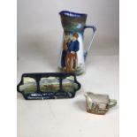 A Royal Doulton character jug H:34cm together with a two handled platter depicting King Arthurs