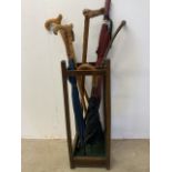 A stick stand with sticks and umbrellas. H:68cm