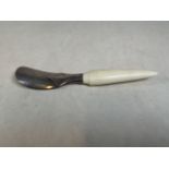 A sterling silver shoe horn with ivory handle by Samuel Jacob London, 1897 24cm.