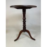 A Victorian mahogany tilt top table with tripod base with oval top. W:41cm x D:52cm x H:68cm