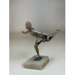 An Art Deco figurine of a ice skater on onyx base. Repair to head. H:23cm