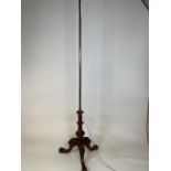 A converted standard lamp with tripod base with adjustable brass and copper top. W:45cm x D:45cm x