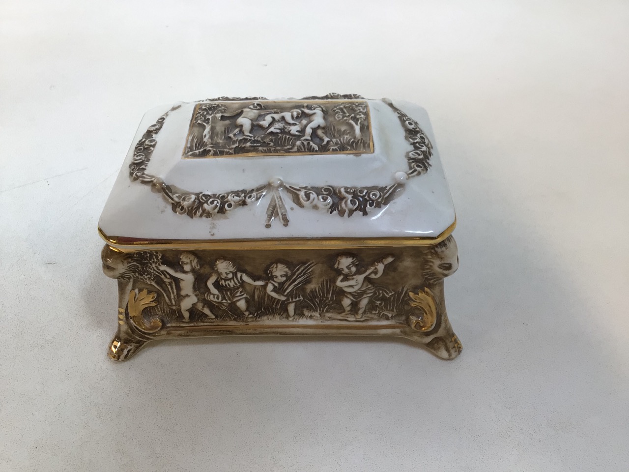 A Capodimonte footed lidded ceramic box decorated with children together with three decorative - Image 2 of 8