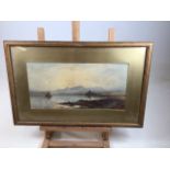 A watercolour on paper of a lake side scene with mountains - slight foxing - framed and glazed.