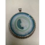 Cameo pendant set within white gold. Folding loop, can be worn as brooch. Hallmark for 375 9kt white