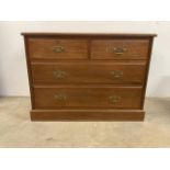 A modern chest of drawers with two short drawers over two long an brass handles. W:108cm x D:53cm