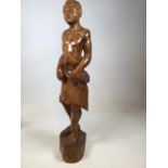 A carved wooden statue of an African man H:90cm