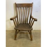 A 19th century elm seated cottage arm chair. Seat height H:35cm