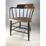 An oak bentwood captains chair with spindle back and replacement seat. Some signs of worm. Seat