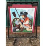 A painted pub sign in metal swing frame.