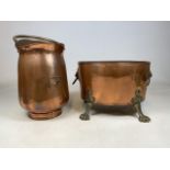 An antique English copper log bin with brass claw feet and lions head handles, also with a large