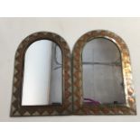 A near pair of hand beaten arts and crafts style copper brass and silvered mirrors. W:29cm x H:43cm