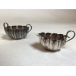 A silver jug and sugar bowl, combined wight 111gm