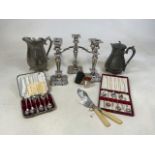 A set of silver plated candelabrum with a triple and two single candlesticks, together with fish